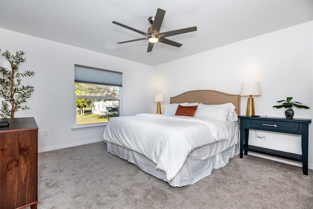 219 Lewis Circle, Unit 112 Punta Gorda, FL 33950 - Photo 24 of 36 a bedroom with a bed and window