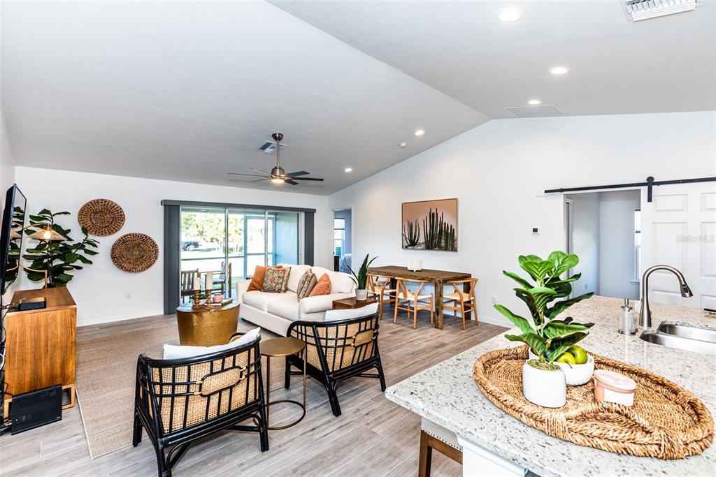 219 Lewis Circle, Unit 112 Punta Gorda, FL 33950 - Photo 8 of 36 a view of a dining room with furniture window and wooden floor