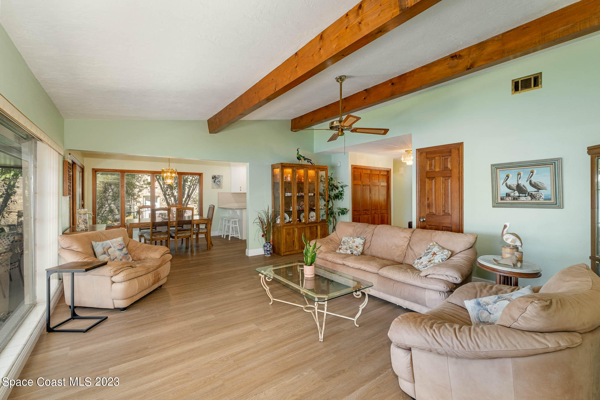 1466 Herndon Circle Palm Bay, FL 32905 - Photo 11 of 23 a living room with furniture and a large window
