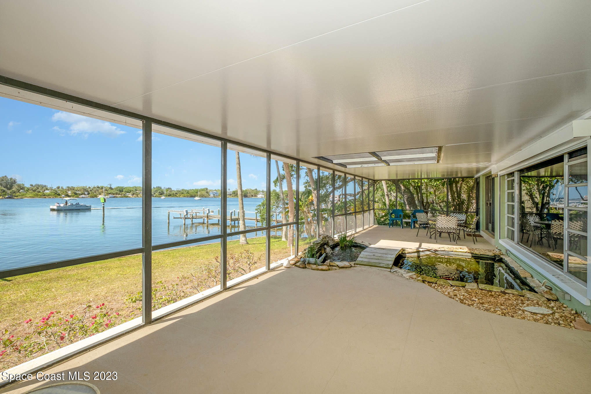 1466 Herndon Circle Palm Bay, FL 32905 - Photo 13 of 23 a view of a floor to ceiling window and an outdoor view