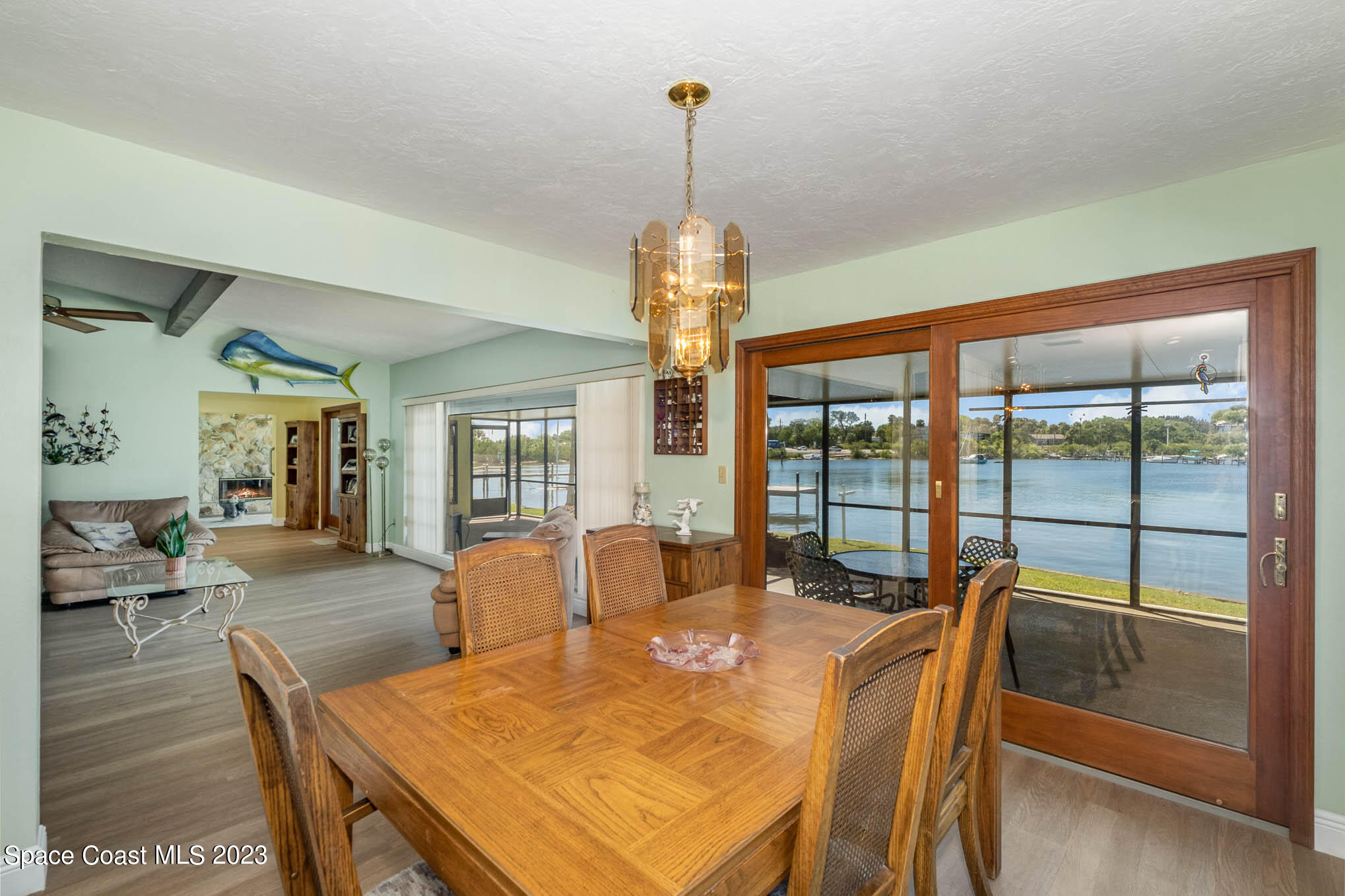 1466 Herndon Circle Palm Bay, FL 32905 - Photo 15 of 23 a view of a dining room with furniture window and wooden floor