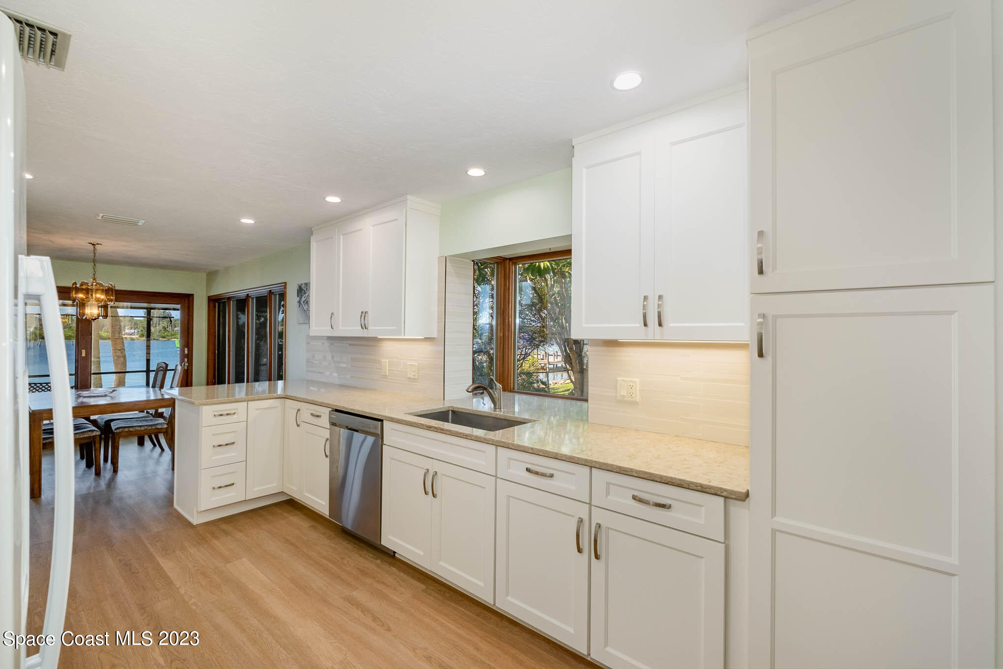 1466 Herndon Circle Palm Bay, FL 32905 - Photo 17 of 23 a kitchen with a sink and cabinets
