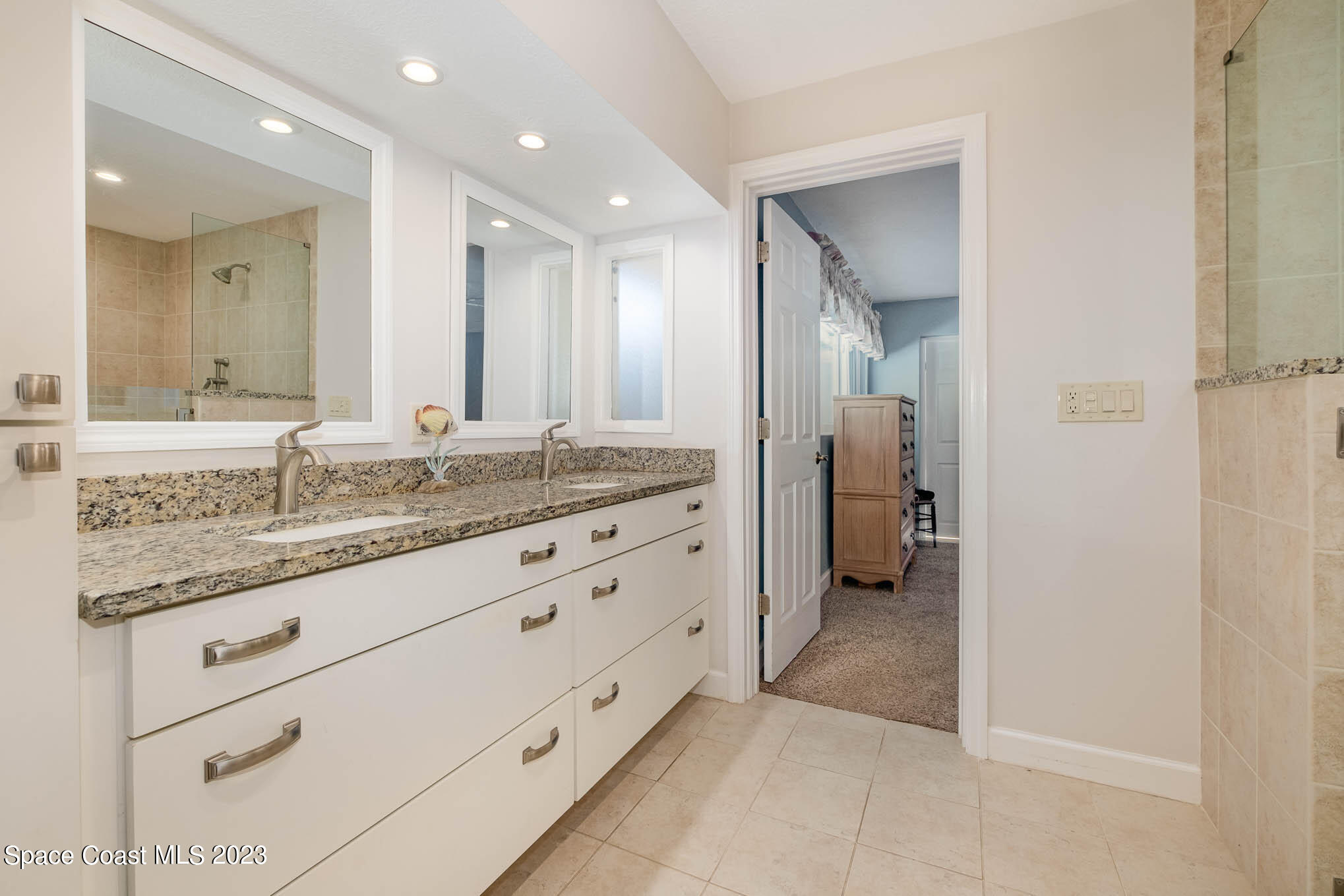 1466 Herndon Circle Palm Bay, FL 32905 - Photo 19 of 23 a bathroom with a granite countertop sink mirror and