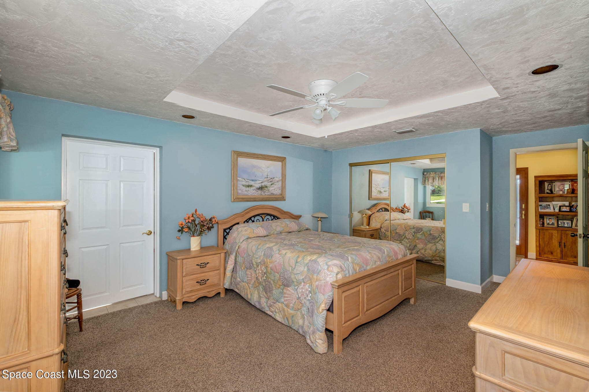 1466 Herndon Circle Palm Bay, FL 32905 - Photo 21 of 23 a bed room with a bed and a lamp