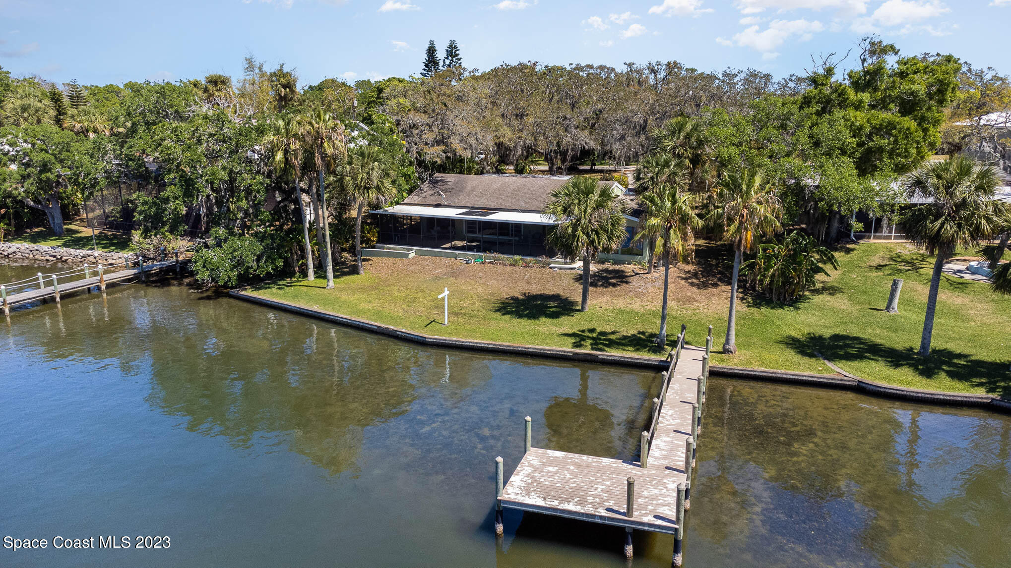 1466 Herndon Circle Palm Bay, FL 32905 - Photo 4 of 23 an aerial view of a house with a lake view