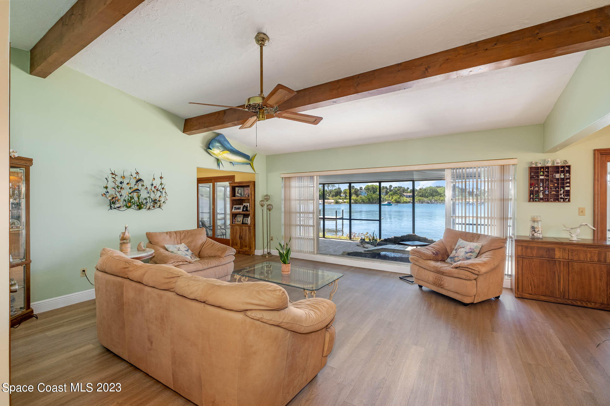 1466 Herndon Circle Palm Bay, FL 32905 - Photo 9 of 23 a living room with furniture and a large window