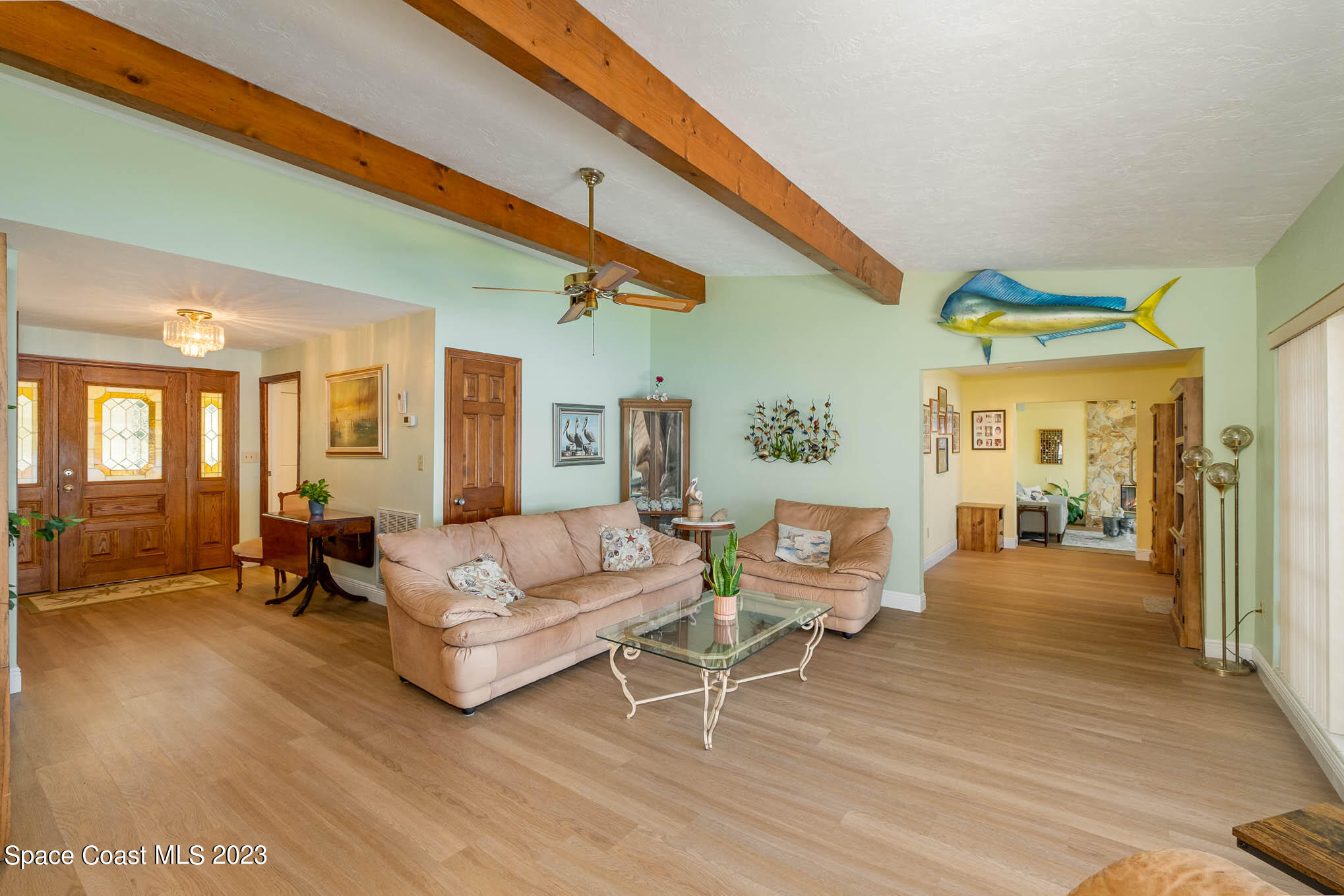 1466 Herndon Circle Palm Bay, FL 32905 - Photo 10 of 23 a living room with furniture and wooden floor
