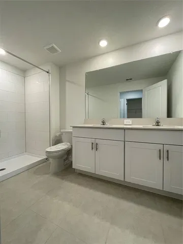 a bathroom with a sink a toilet and a bathtub