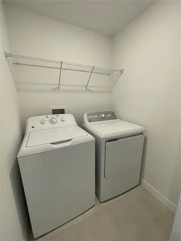 a view of a yard with large trees