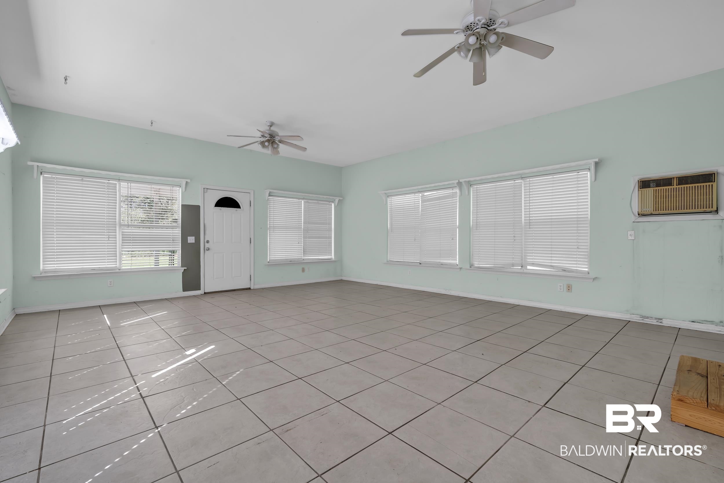 17463 Highway 98 Foley, AL 36535 - Photo 11 of 57 Unfurnished living room featuring ceiling fan and tile patterned flooring