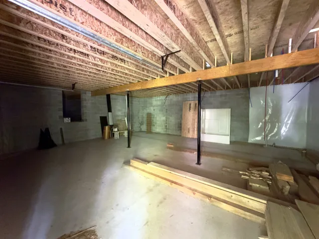 a view of a patio with table and chairs