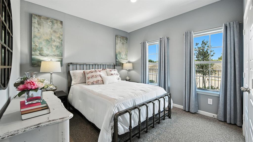 557 Pendleton Avenue Keene, TX 76059 - Photo 17 of 32 a bedroom with a bed and a window