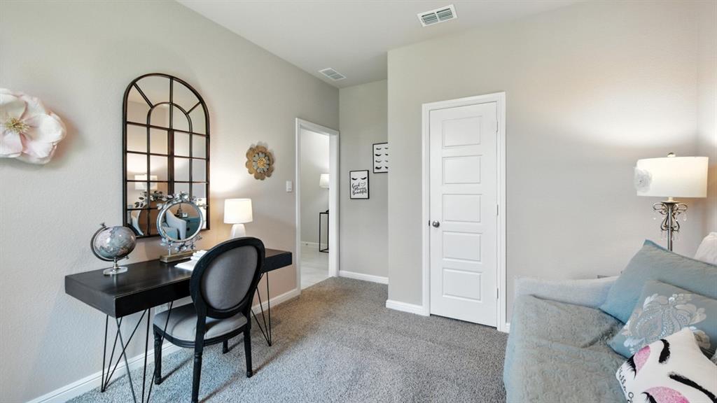 557 Pendleton Avenue Keene, TX 76059 - Photo 23 of 32 a view of a livingroom with furniture and a window