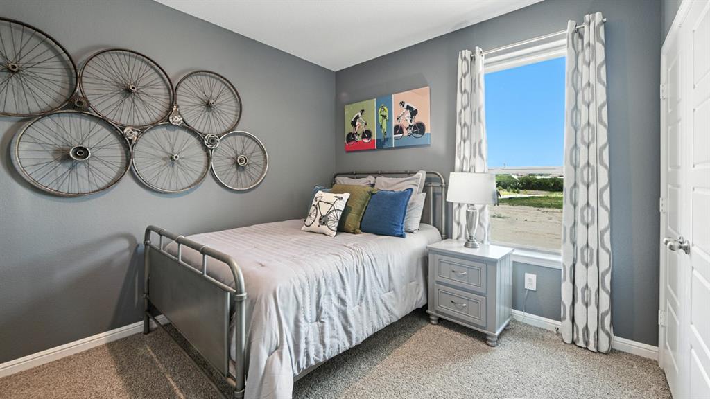 557 Pendleton Avenue Keene, TX 76059 - Photo 24 of 32 a bedroom with a bed and a window