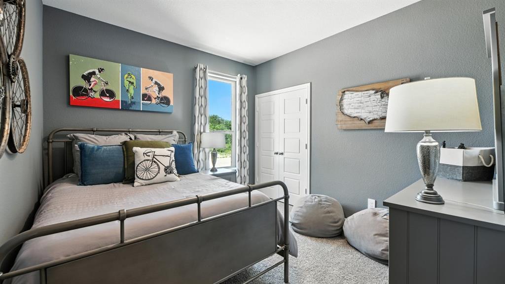 557 Pendleton Avenue Keene, TX 76059 - Photo 25 of 32 a living room with furniture and wall paintings