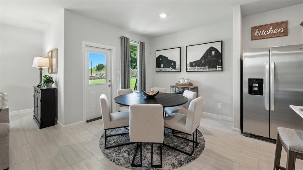 557 Pendleton Avenue Keene, TX 76059 - Photo 6 of 32 a dining room with furniture and window