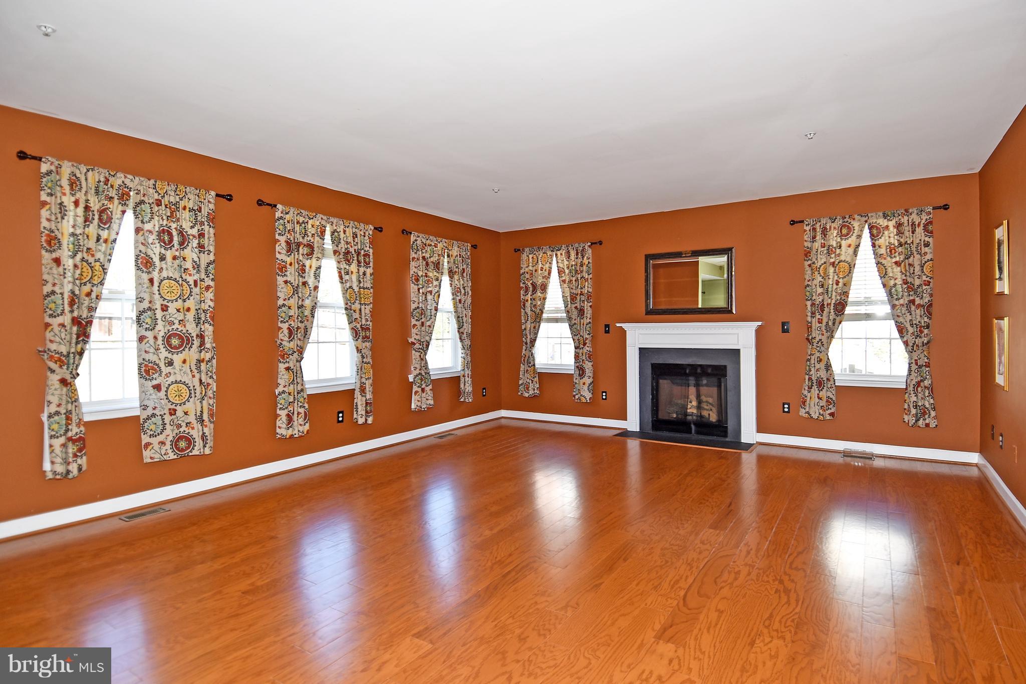 14102 Punch Street Silver Spring, MD 20906 - Photo 11 of 30 a view of an empty room with wooden floor and a window