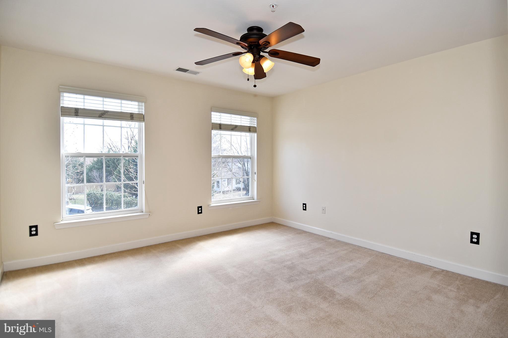 14102 Punch Street Silver Spring, MD 20906 - Photo 24 of 30 an empty room with windows and fan