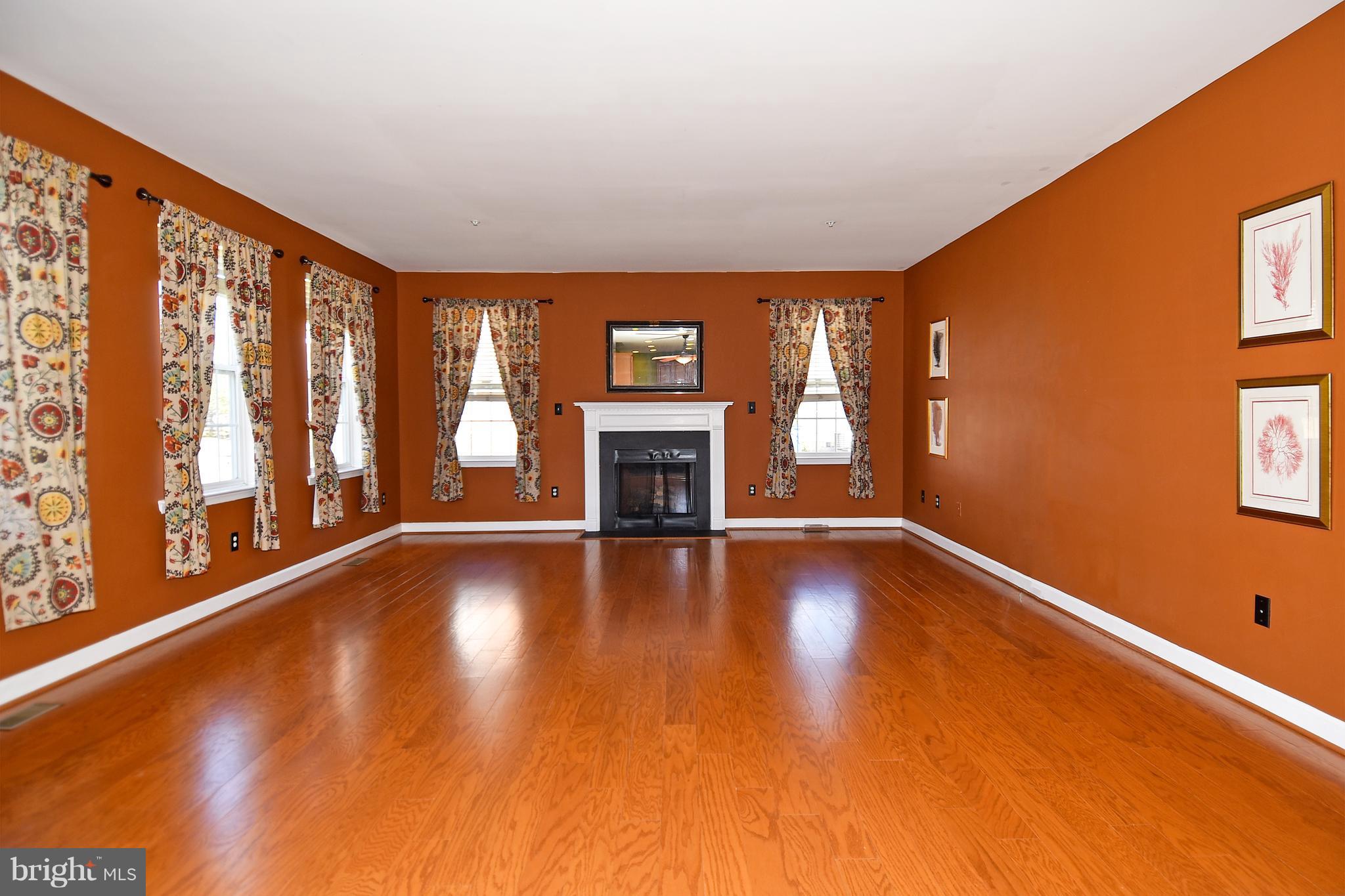 14102 Punch Street Silver Spring, MD 20906 - Photo 10 of 30 a view of an empty room with wooden floor and a window