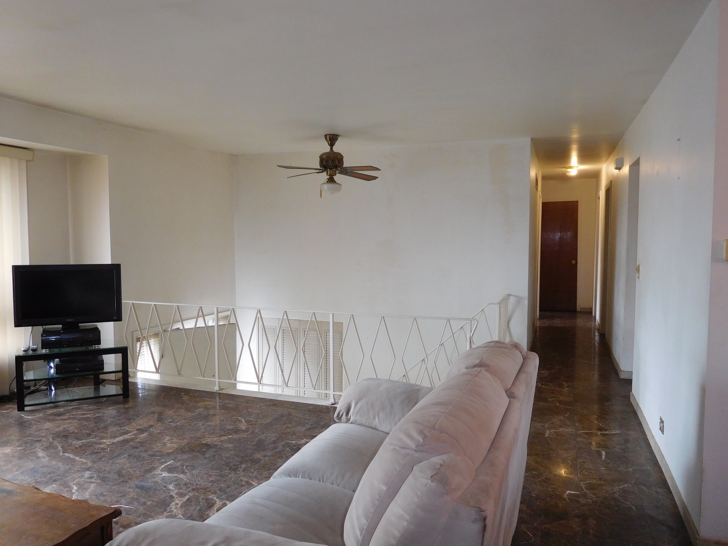1059 South Finley Road Lombard, IL 60148 - Photo 6 of 14 a living room with furniture and a flat screen tv