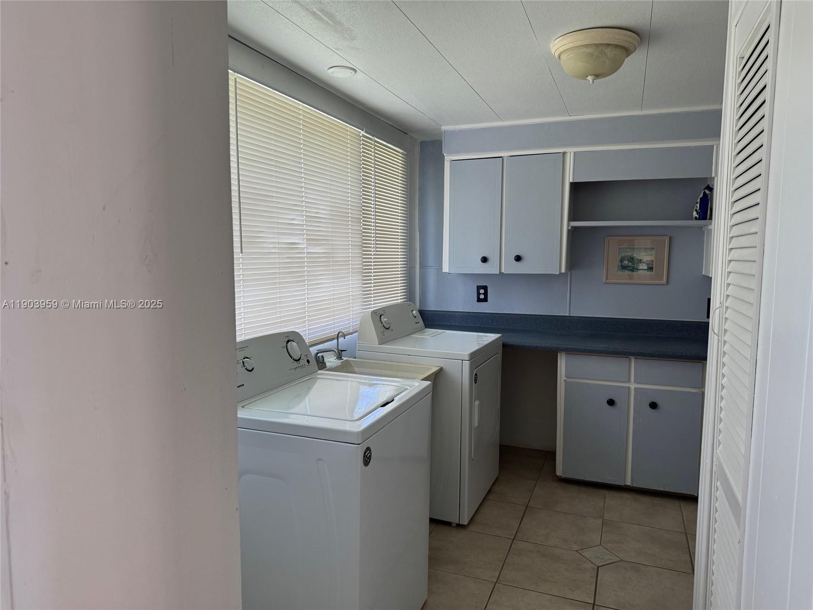 900 Morris Avenue Key Largo, FL 33037 - Photo 6 of 13 a kitchen with a sink cabinets and appliances