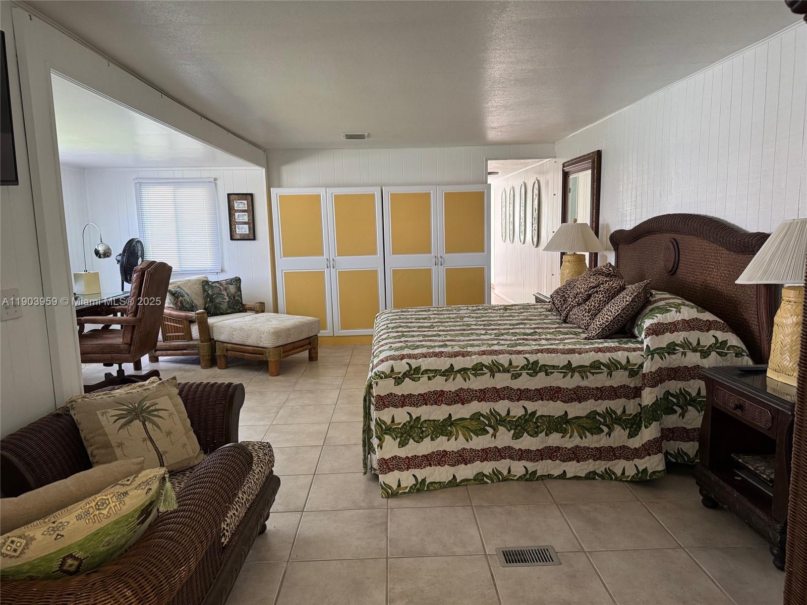 900 Morris Avenue Key Largo, FL 33037 - Photo 7 of 13 a bedroom with a bed couch and window