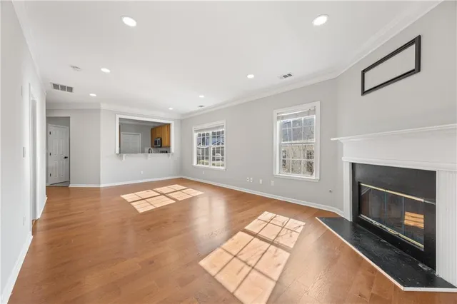 a view of empty room with a fireplace