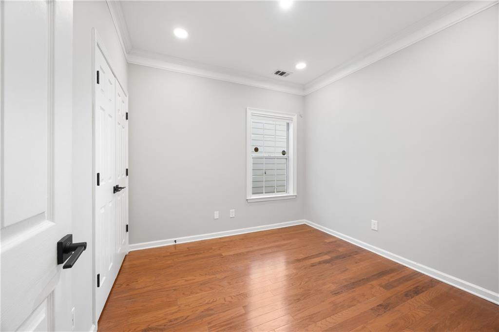 1644 Donovan's Ridge Kennesaw, GA 30152 - Photo 24 of 37 an empty room with wooden floor and a window