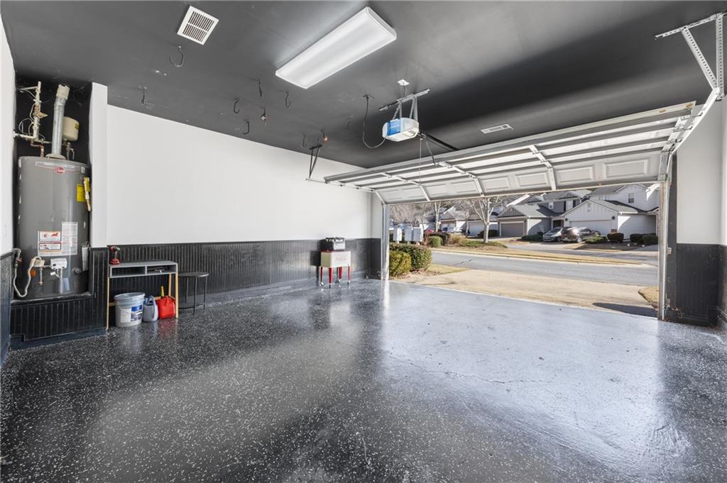 1644 Donovan's Ridge Kennesaw, GA 30152 - Photo 26 of 37 a view of a garage with a white car parked