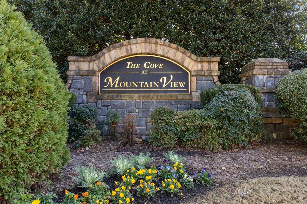 1644 Donovan's Ridge Kennesaw, GA 30152 - Photo 37 of 37 a sign that is sitting in front of flowers