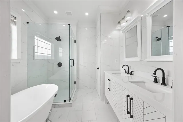 a bathroom with a double vanity sink mirror and shower