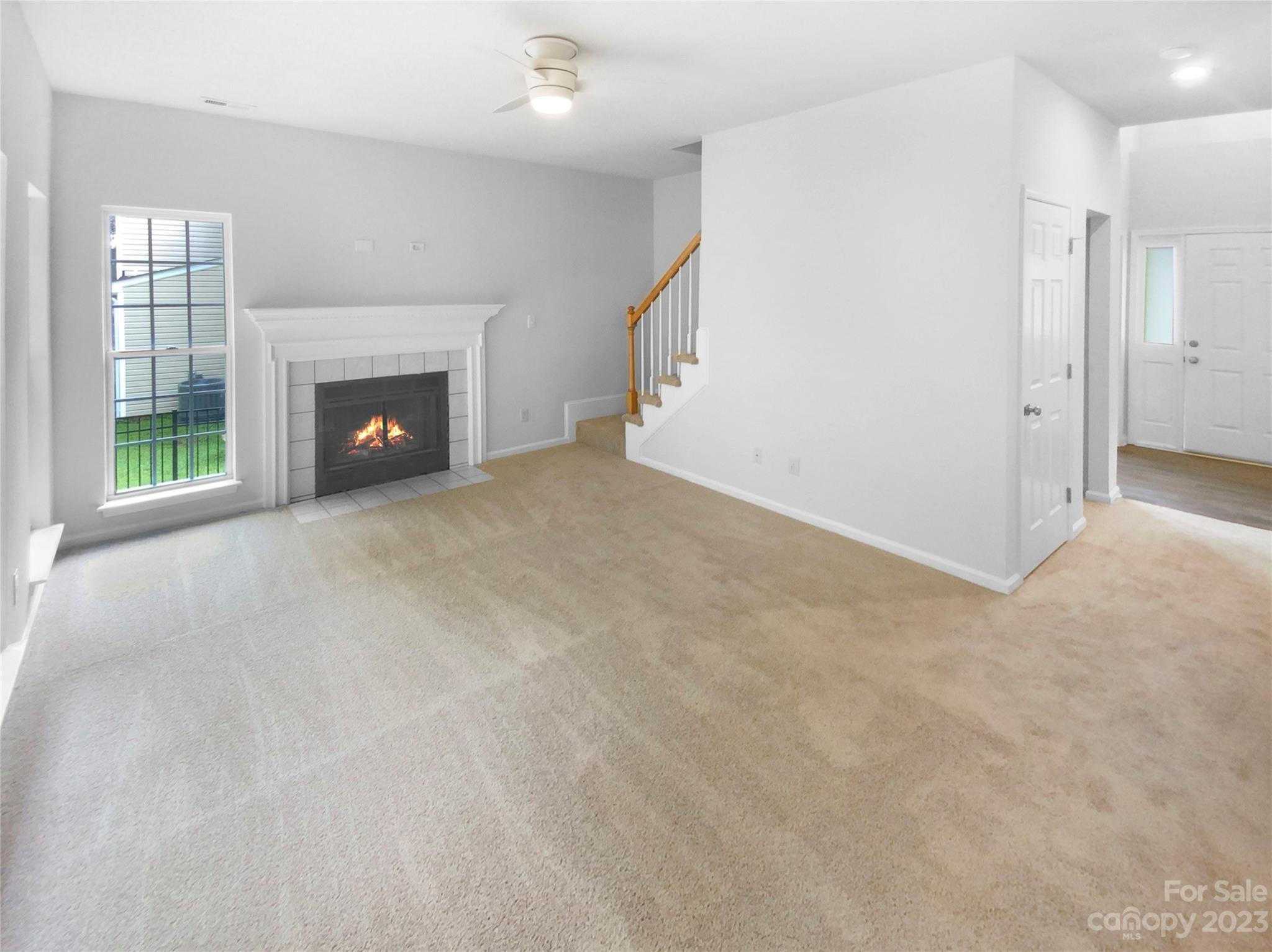 114 Shade Tree Circle Fort Mill, SC 29715 - Photo 3 of 20 a view of an empty room with a fireplace