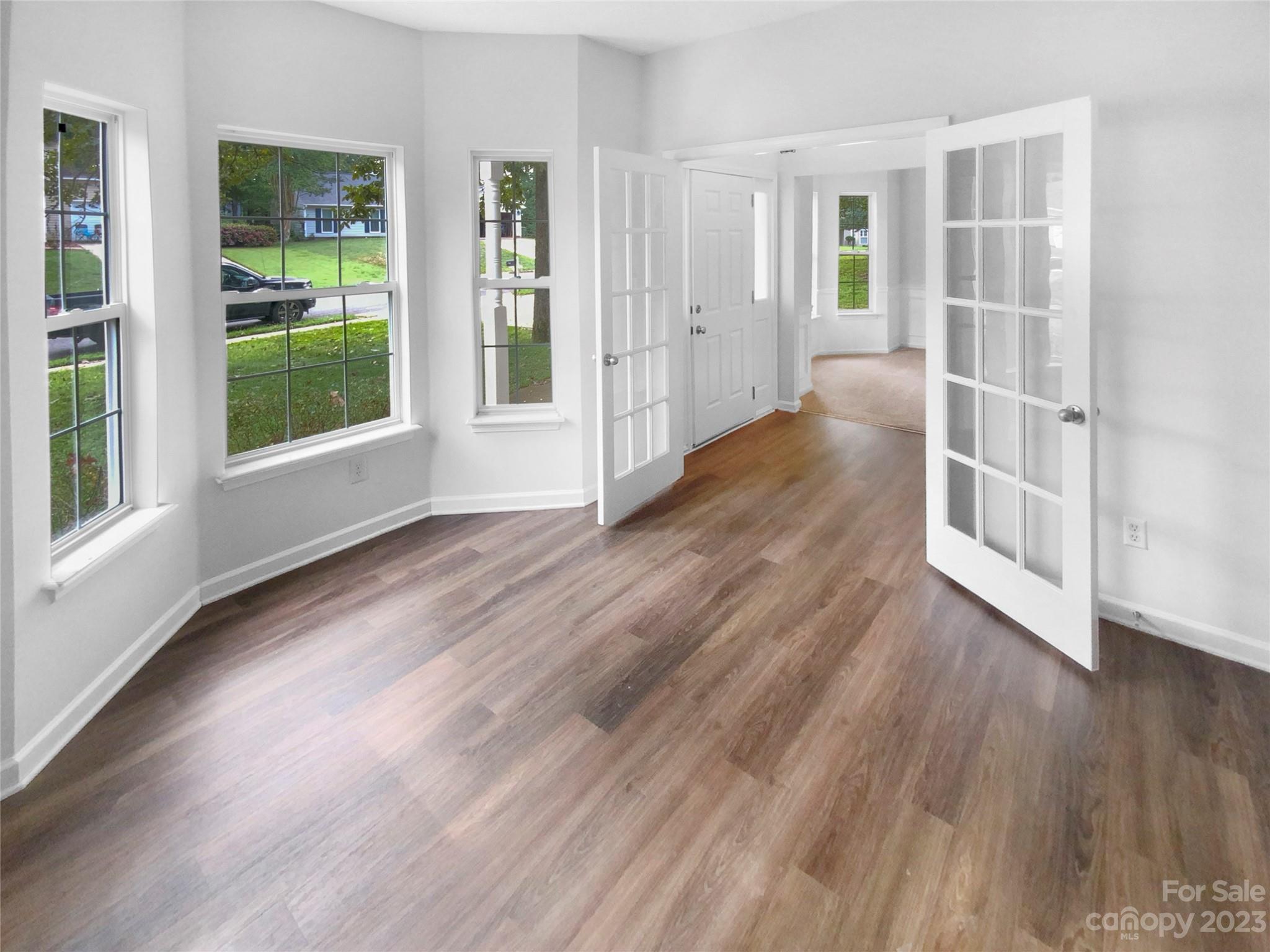 114 Shade Tree Circle Fort Mill, SC 29715 - Photo 10 of 20 a view of wooden floor and windows in a room