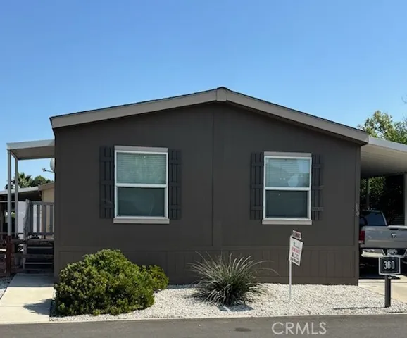 a black and white house with a outdoor space