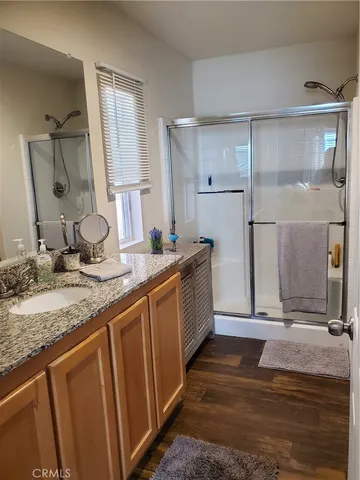 a bedroom with a bed and cabinets