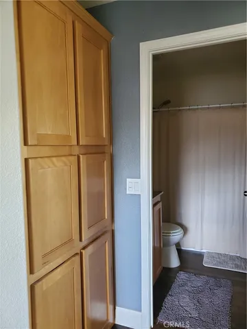 a view of a street with palm trees