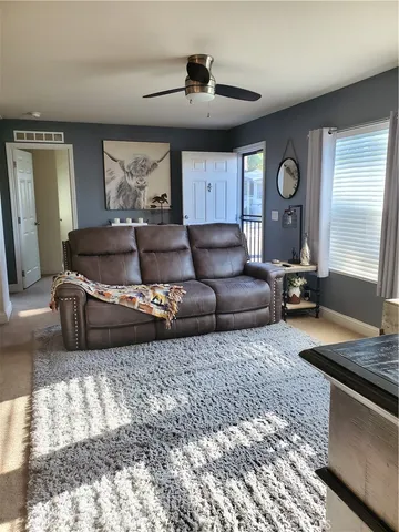 a living room with furniture and a window