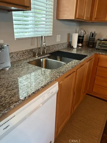 a kitchen with a stove a sink and a microwave