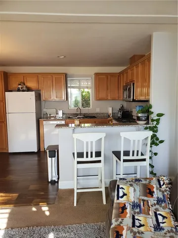 a bed sitting in a bedroom next to a lamp