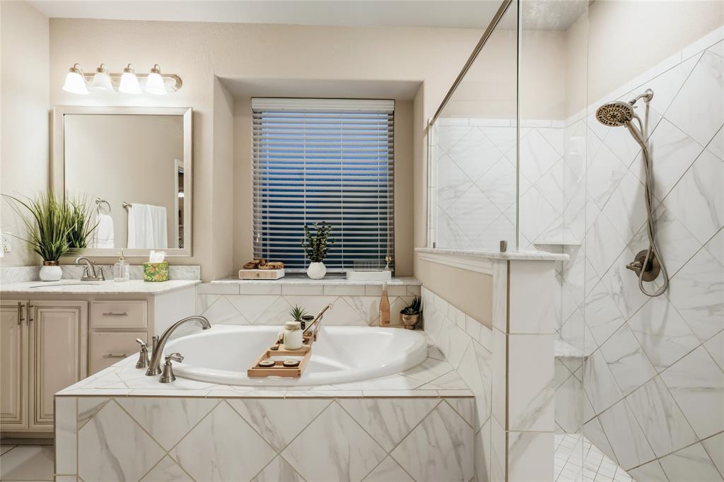 1802 Roundtree Road Forney, TX 75126 - Photo 25 of 39 a bathroom with a sink and a mirror