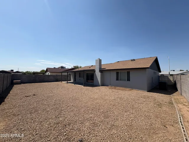 a house view with a backyard space
