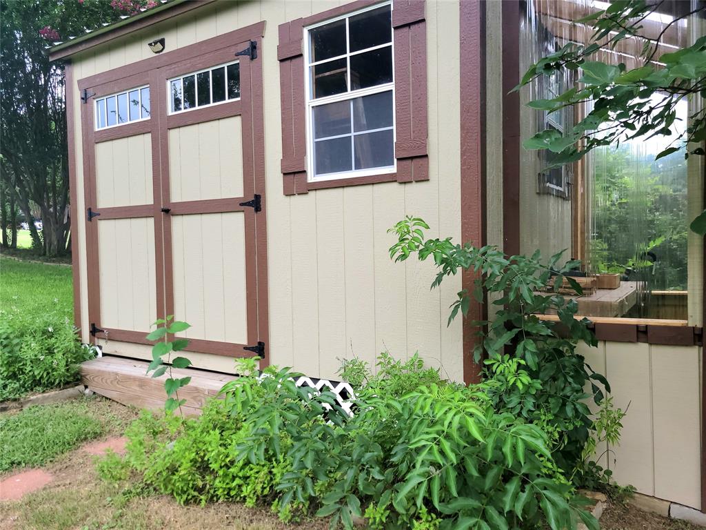 912 North Dove Road Grapevine, TX 76051 - Photo 28 of 36 a front view of a house with a yard and potted plants