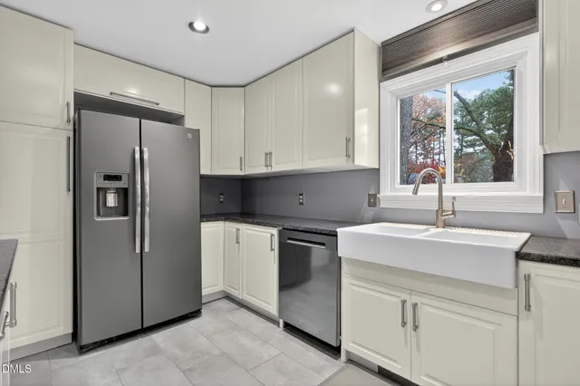 a view of a house with wooden deck