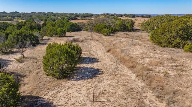 an aerial view of house with yard