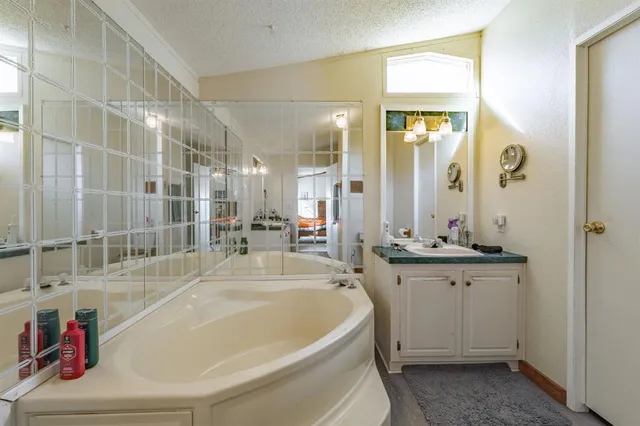 a kitchen with a sink cabinets and wooden floor