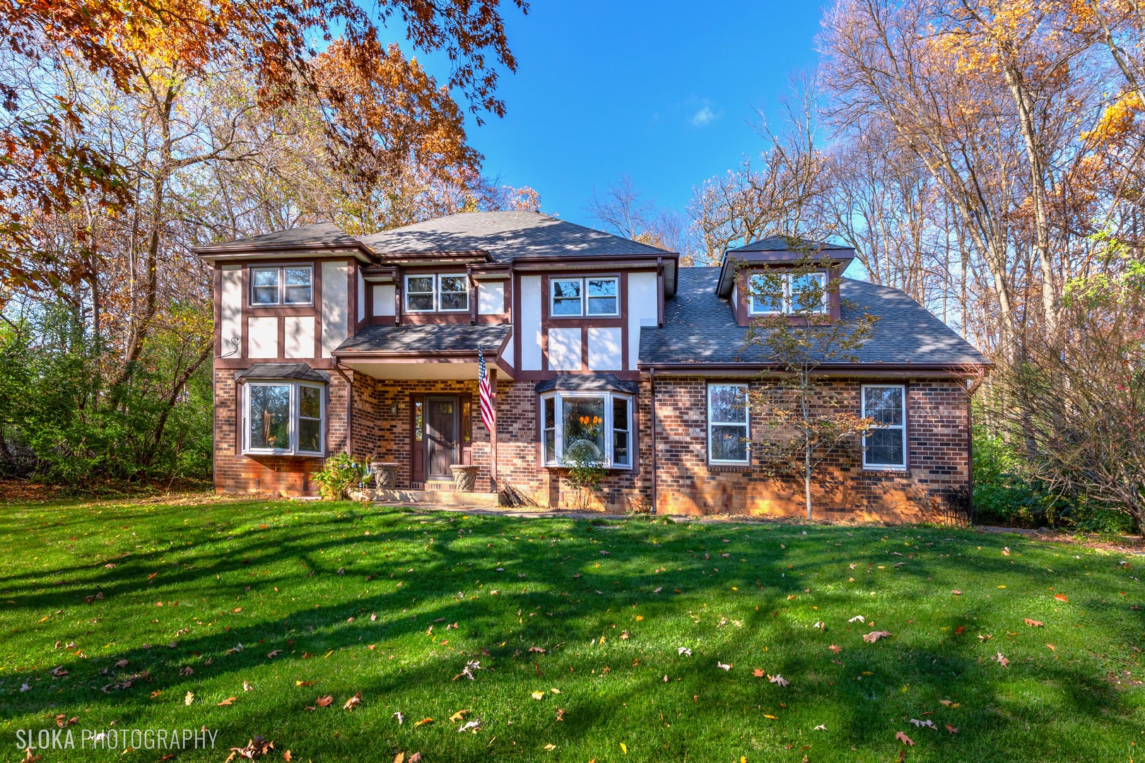 6906 Red Barn Road Crystal Lake, IL 60012 - Photo 1 of 40 a front view of a house with garden