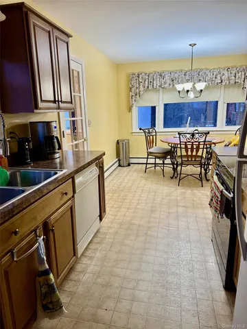 a kitchen with stainless steel appliances a sink cabinets and a counter top space