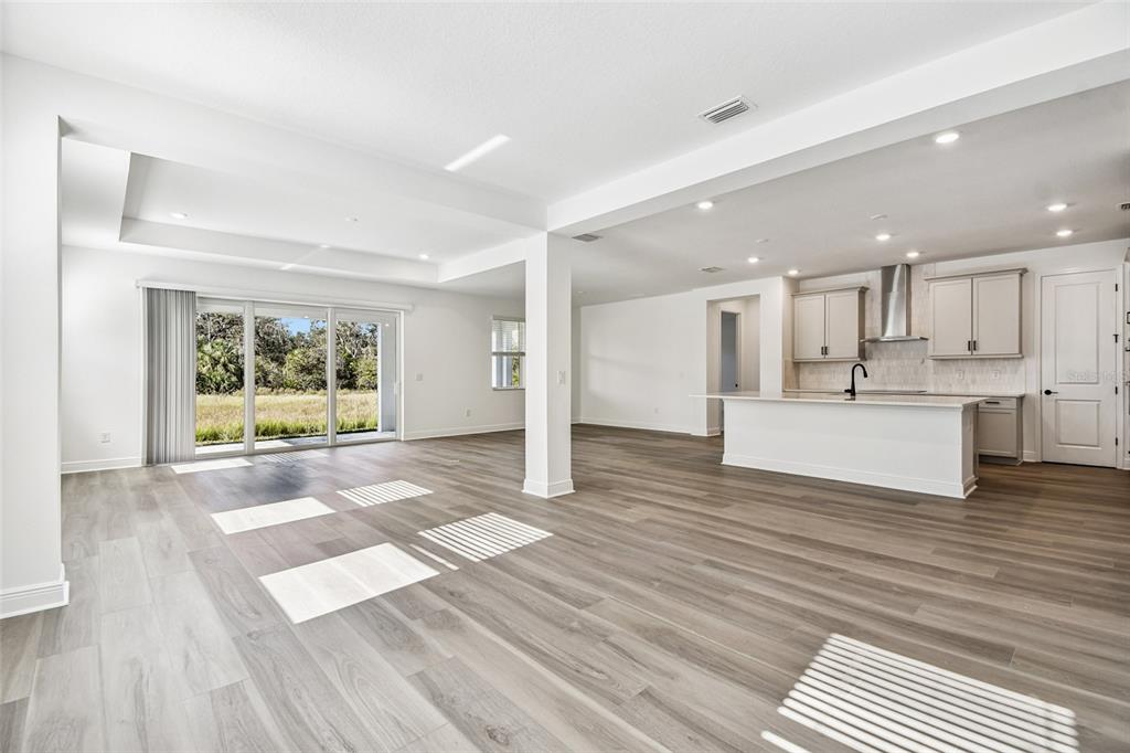 3677 142nd Terrace Parrish, FL 34219 - Photo 19 of 93 a view of a kitchen with wooden floor and a window