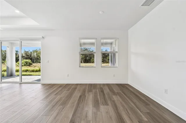 a bathroom with a granite countertop shower mirror and a sink