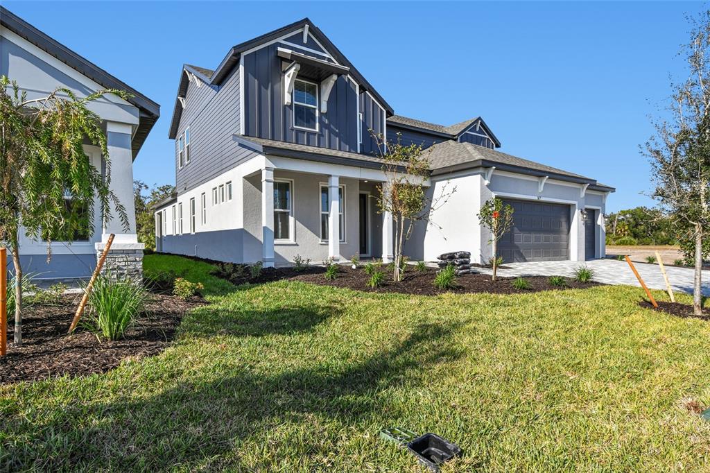 3677 142nd Terrace Parrish, FL 34219 - Photo 2 of 93 a front view of a house with a yard